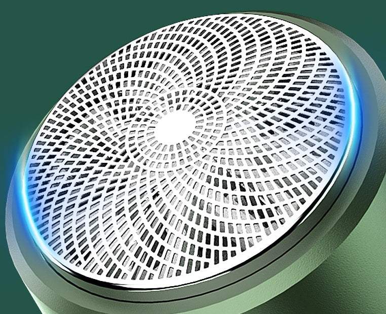 Close-up of portable rechargeable multifunctional electric shaver metal blade net with blue light ring