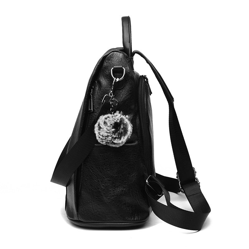 Black genuine leather sheepskin patchwork mini chain shoulder bag with adjustable strap and fluffy pompom accessory