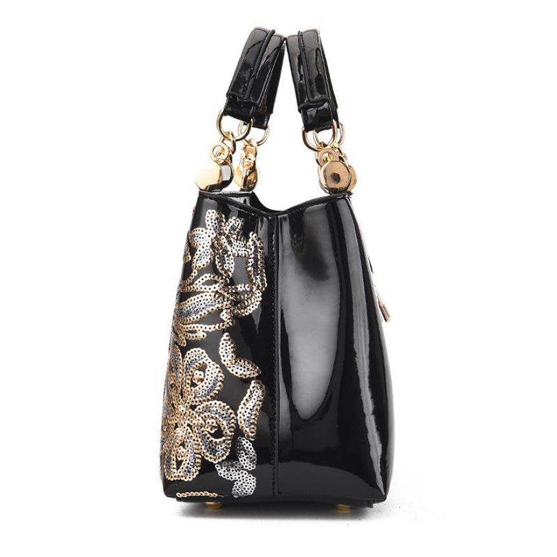 black patent PU handbag with gold and silver sequin floral embroidery and dual handles for party and wedding use