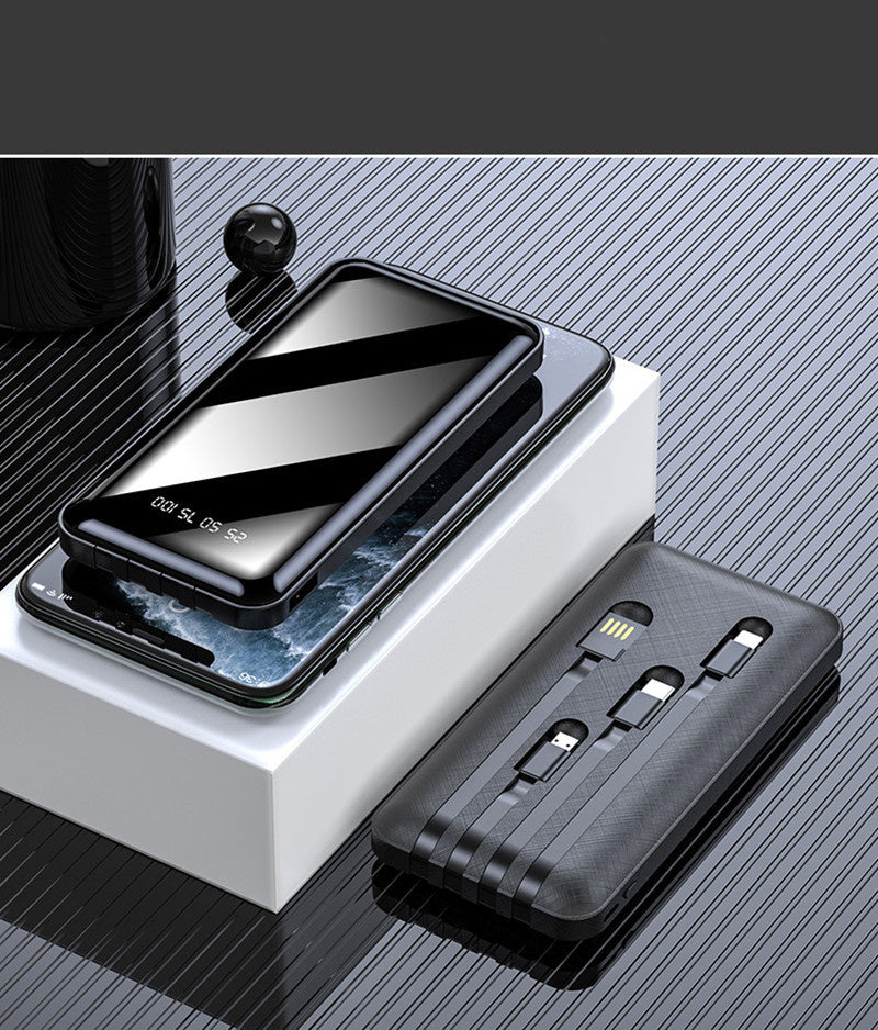 Large capacity mobile power bank with multi USB ports and built-in cables in black on a reflective surface