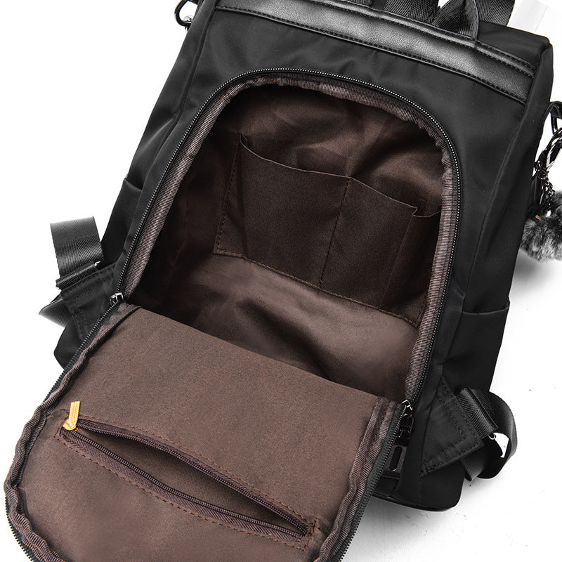 Black sheepskin patchwork mini chain shoulder bag with open compartment and inner pockets