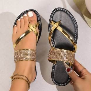 Black toe covering rhinestones strap flat bottom beach sandals with gold accents