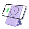 Portable magnetic wireless power bank fast charger with phone stand in purple color