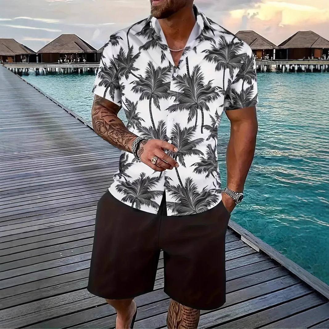 Fashion men's Hawaii short sleeve suit with black palm tree print and black shorts on a model by the sea