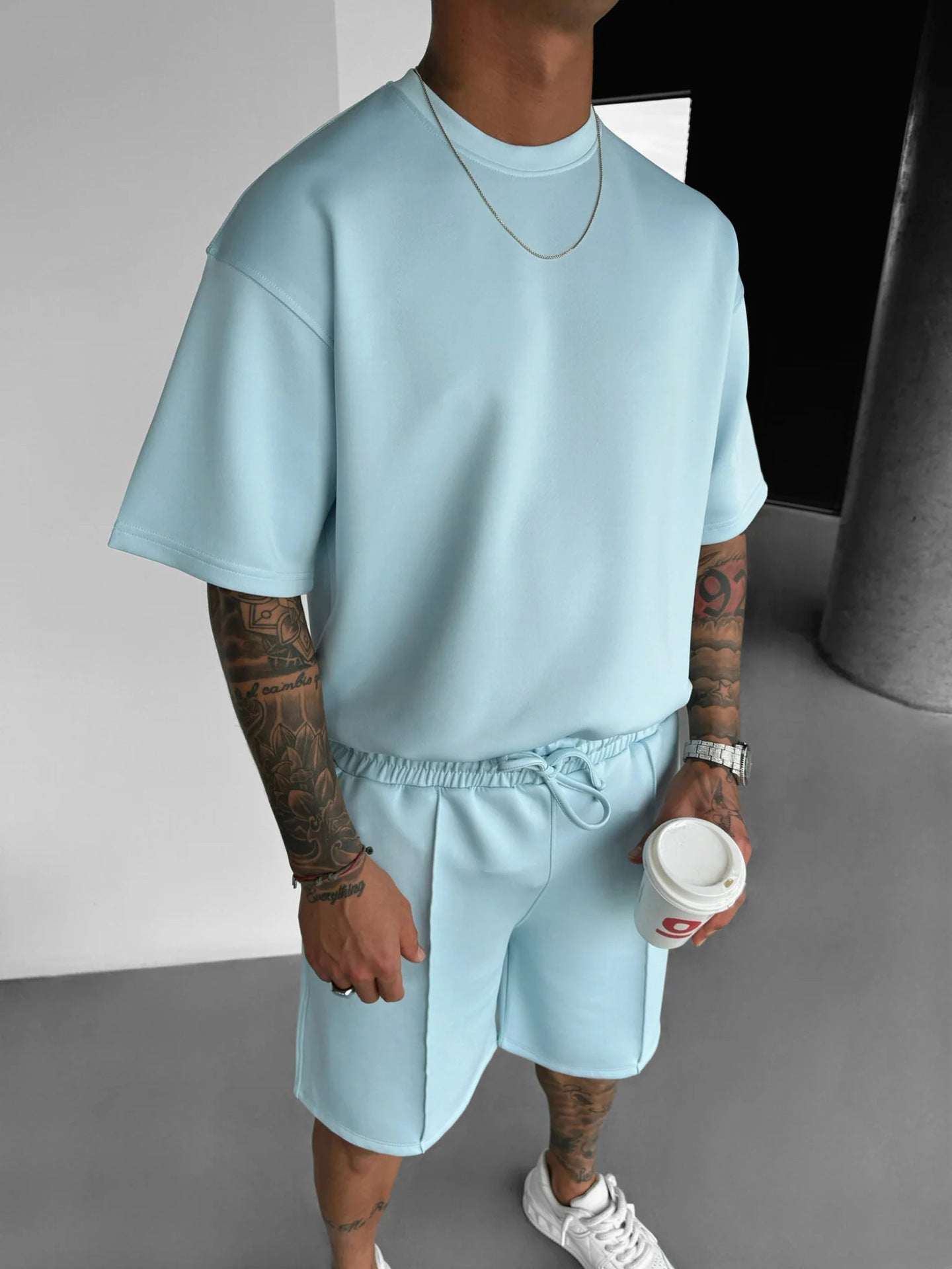 Men's summer short sleeve sports shorts suit in light blue polyester fiber fabric
