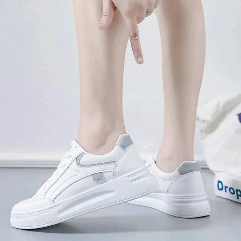 White women's fashion sneakers with lace-up design and gray accents, comfortable casual running shoes for hard courts