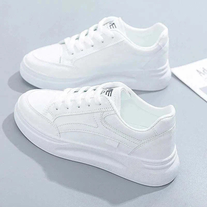 White women's fashion sneakers with lace-up design and rubber sole for casual wear