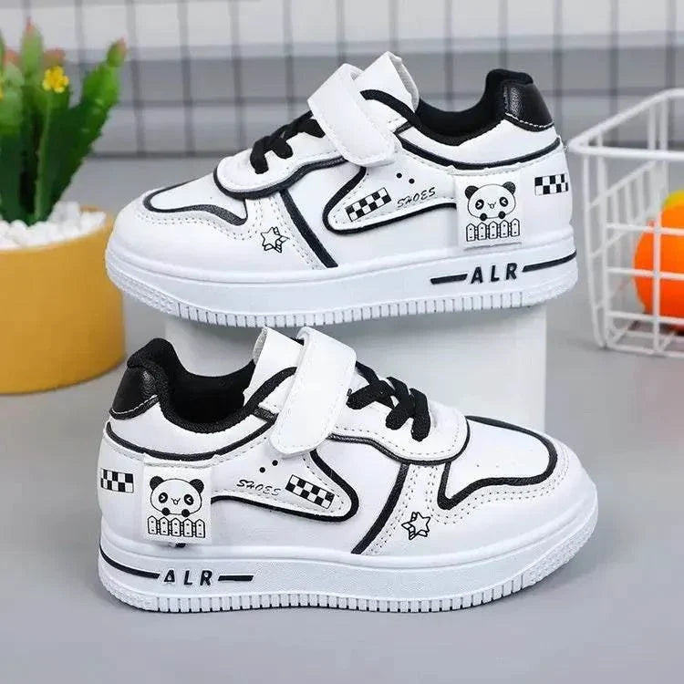 White and black children's sneakers with panda design and velcro strap for casual outdoor wear