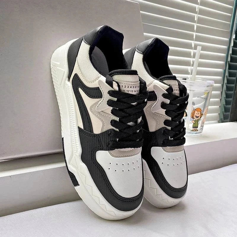 Fashion small white and black casual women's sports sneakers with thick soles and lace-up closure