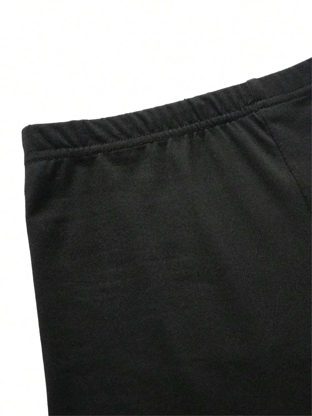 Close-up of black elastic waist shorts from women’s summer slim-fit t-shirt and shorts 2-piece set with heart pattern prints