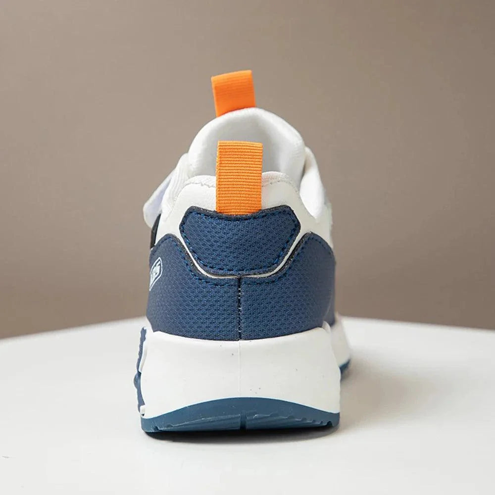 Back view of blue and white PU leather sport shoe for children with orange pull tab and hook & loop closure