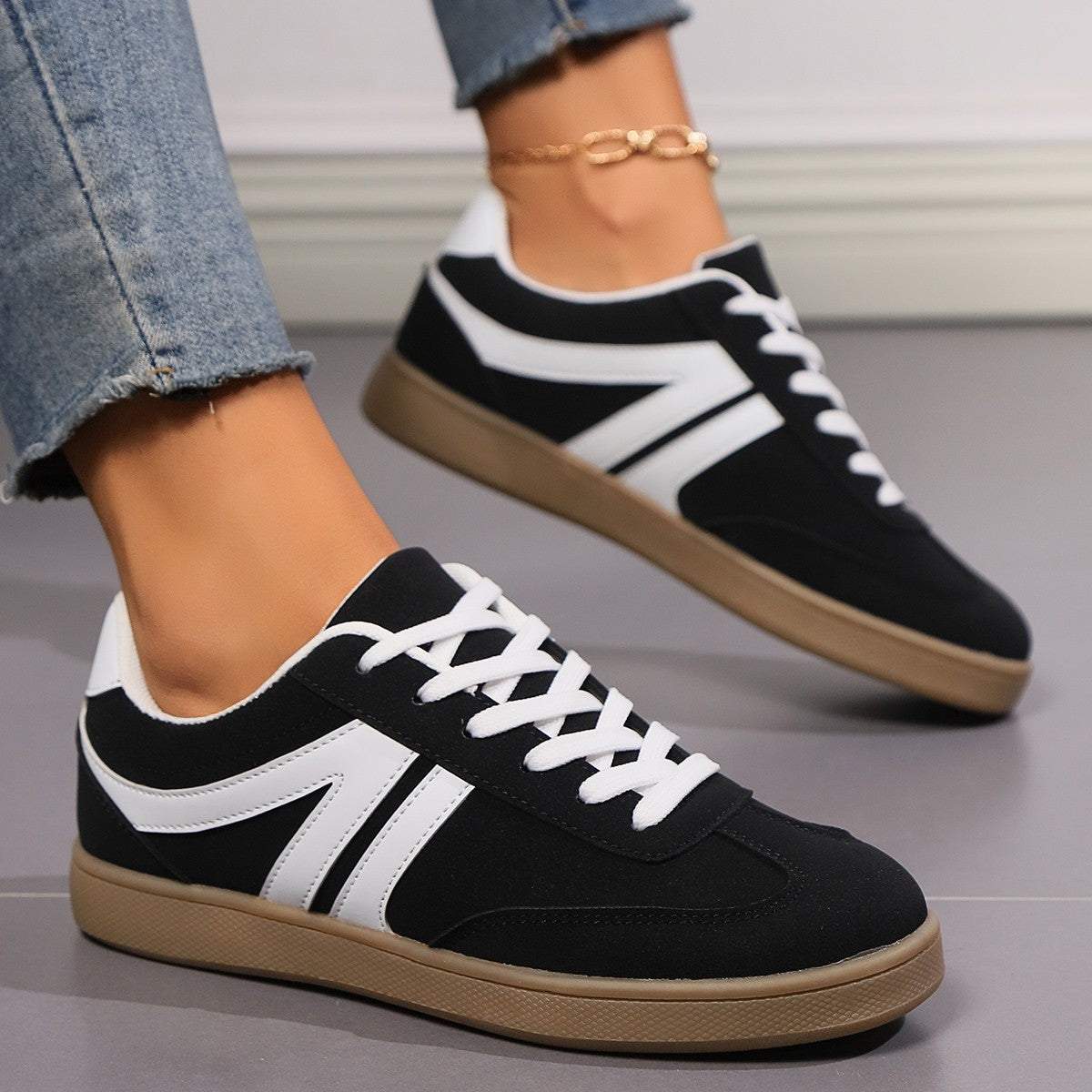 Black and white lace-up round toe flats shoes for women with casual sporty design