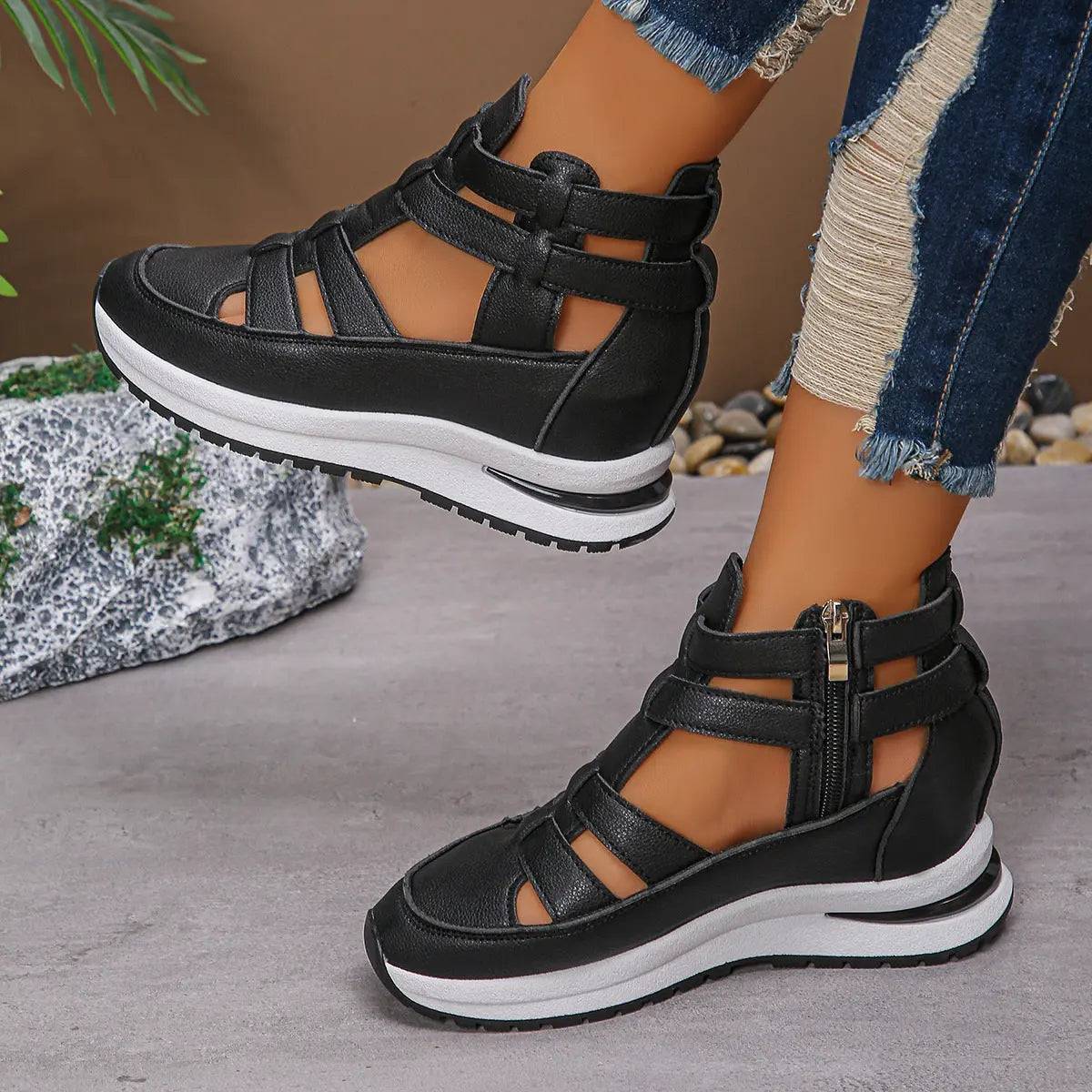 Black women's close-toed hollow-out platform sandals with velcro straps and rubber sole