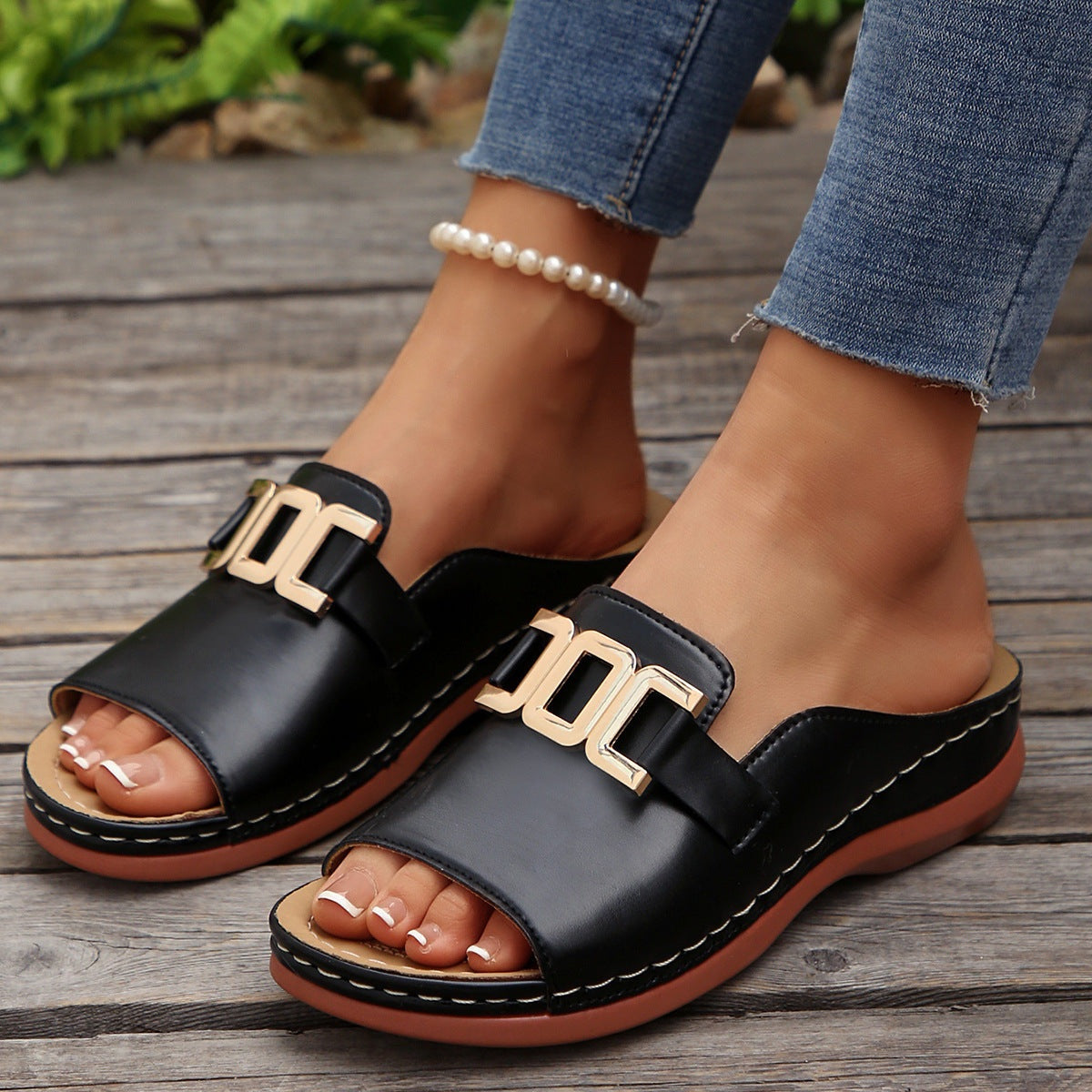 Black Ins Chain Wedges platform peep-toed sandals with gold chain detail and thick sole worn with jeans