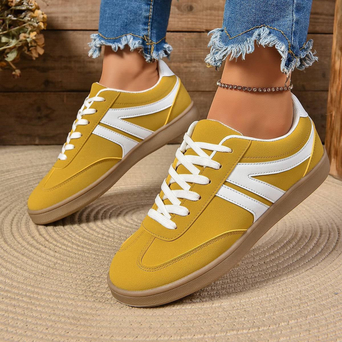 Yellow lace-up round toe flats shoes with white accents for women, casual and comfortable slip-on style